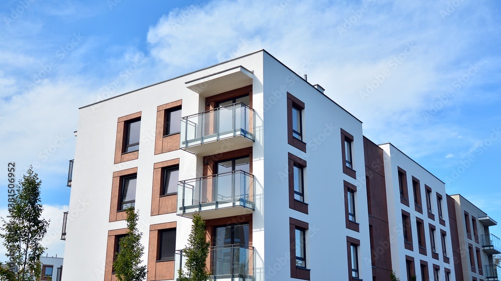 Futuristic square architecture of apartment building for real estate with big windows.