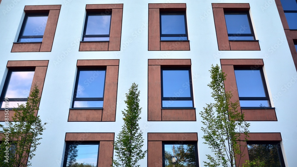 Futuristic square architecture of apartment building for real estate with big windows.