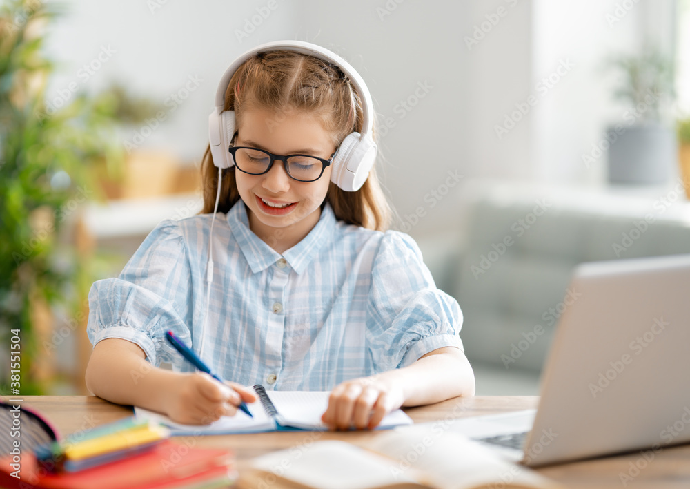 Girl doing homework or online education.