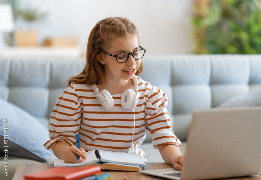 Girl doing homework or online education.