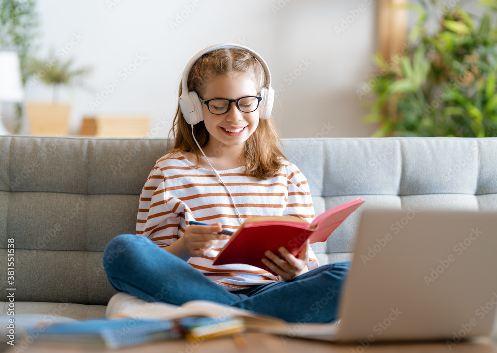 Girl doing homework or online education.