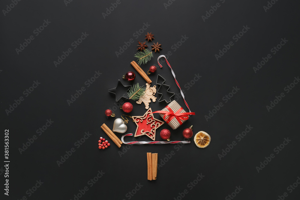 Christmas tree made of New Year decor on dark background