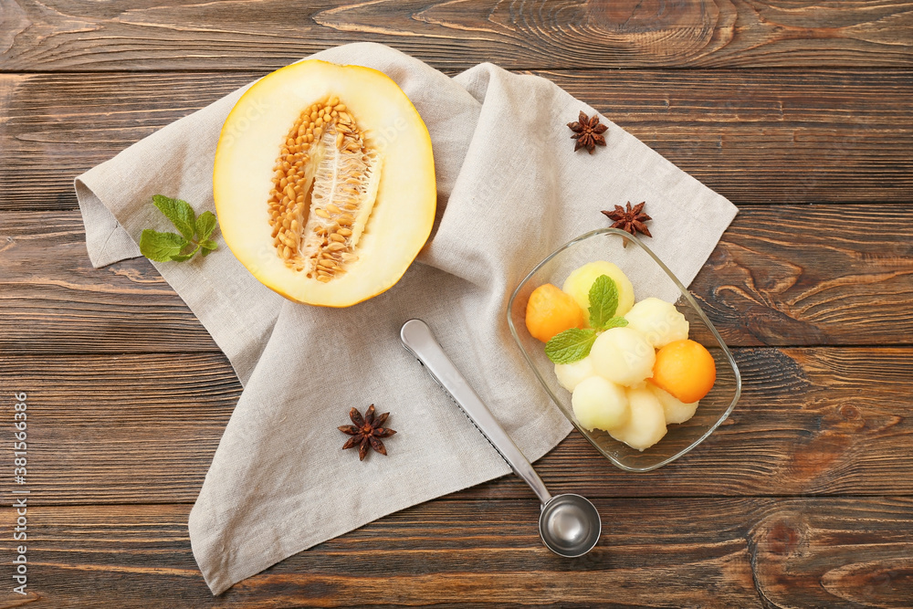 Bowl with tasty melon balls on table