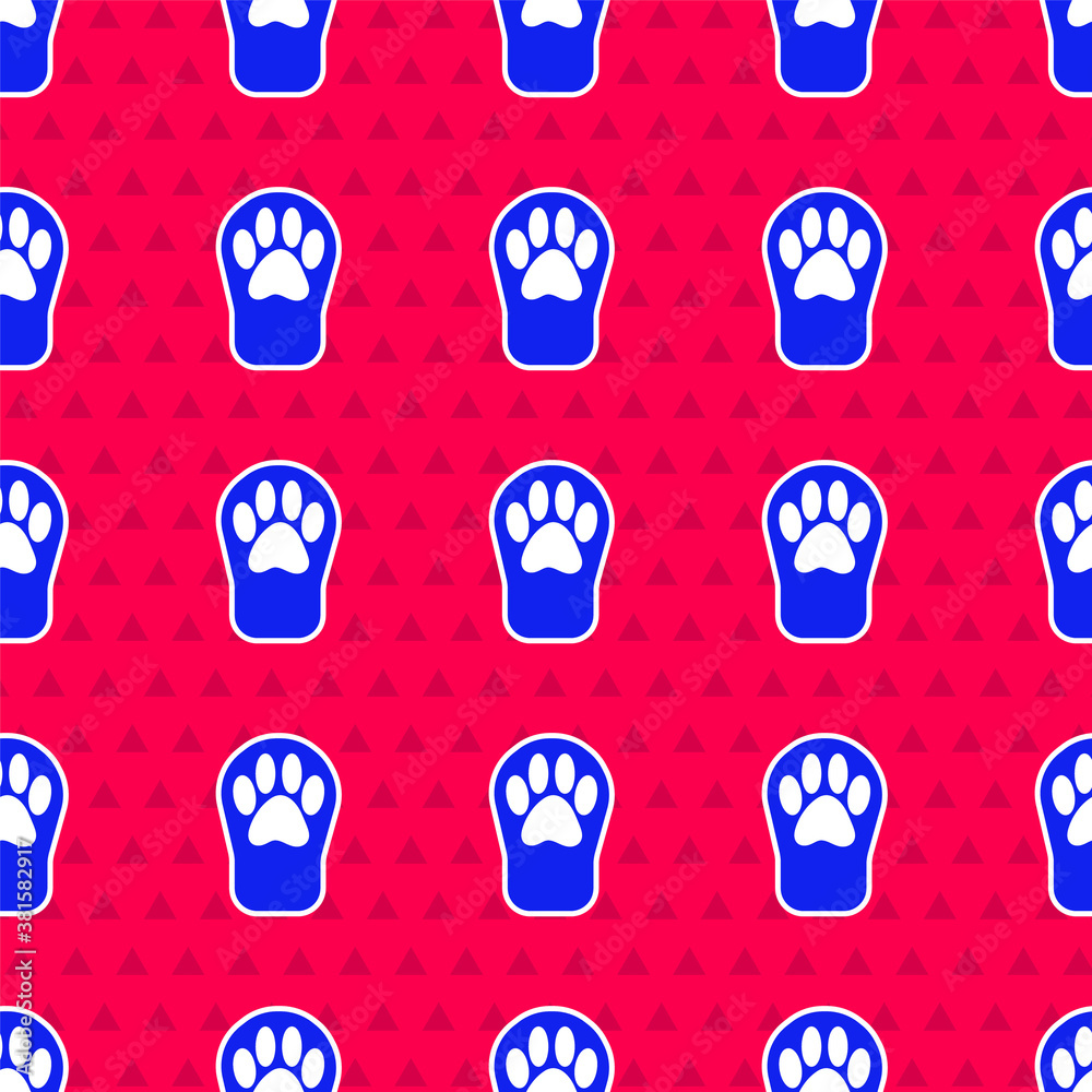 Blue Paw print icon isolated seamless pattern on red background. Dog or cat paw print. Animal track.