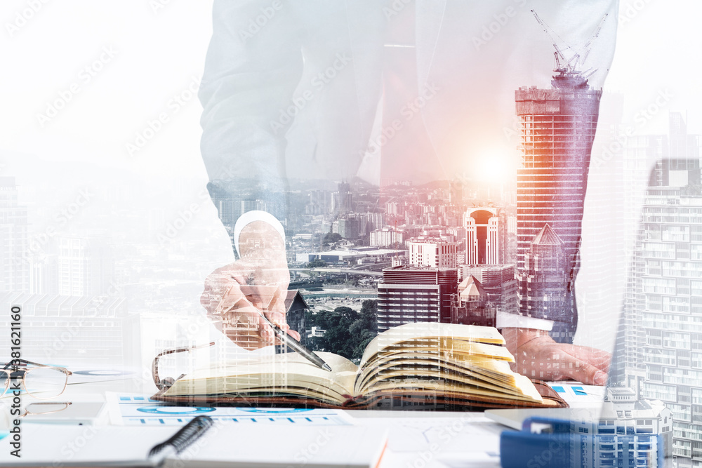 Businessman analyzing financial documents at desk