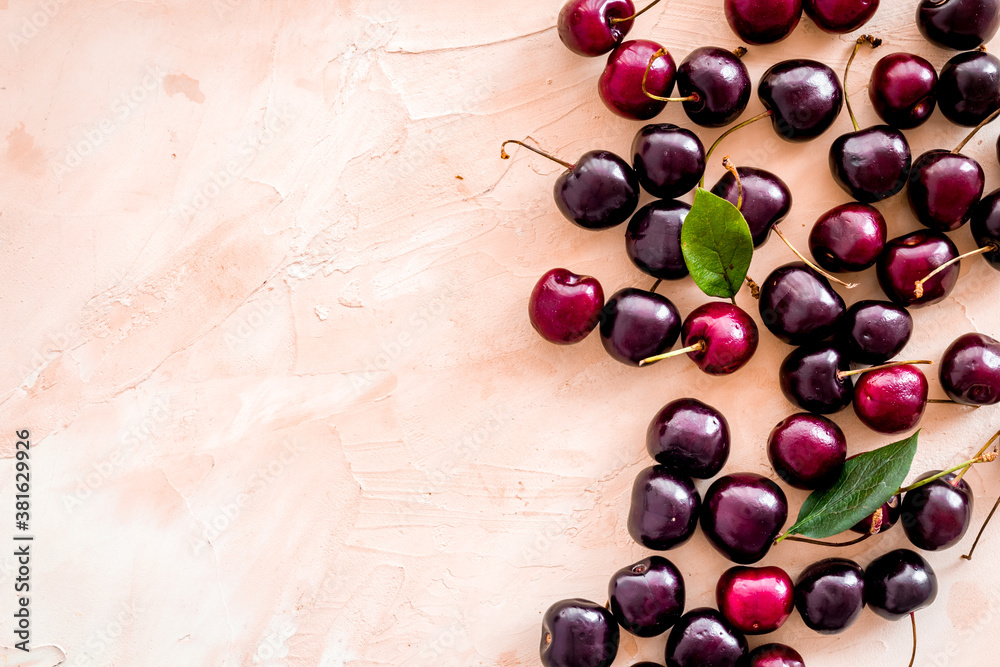 Red sweet cherry texture or wallpaper. Flat lay of berries, top view