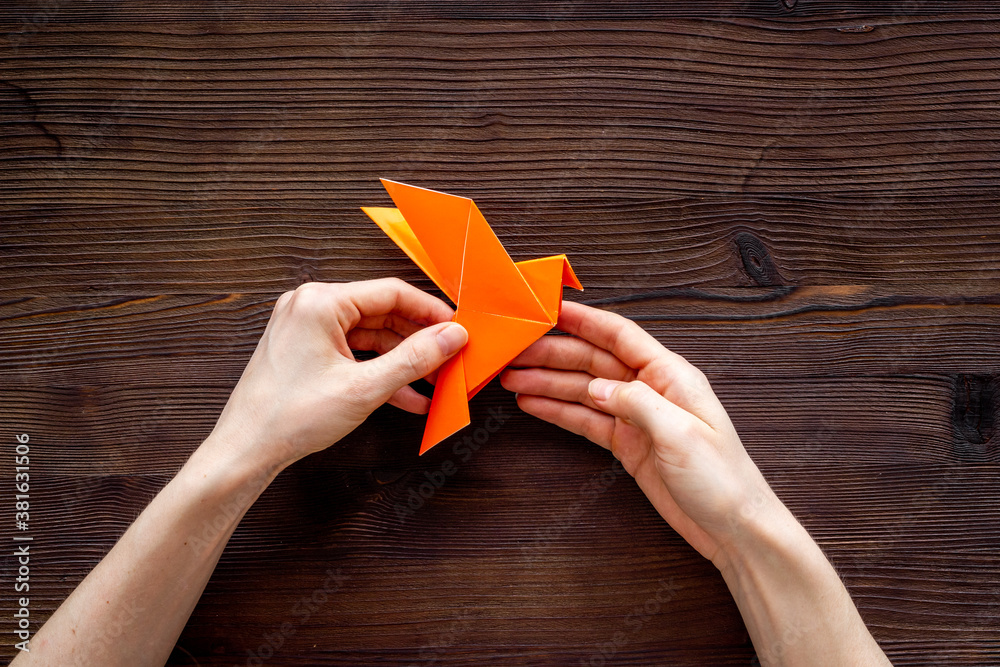 Origami pigeon. World Peace Day, care concept. Top view