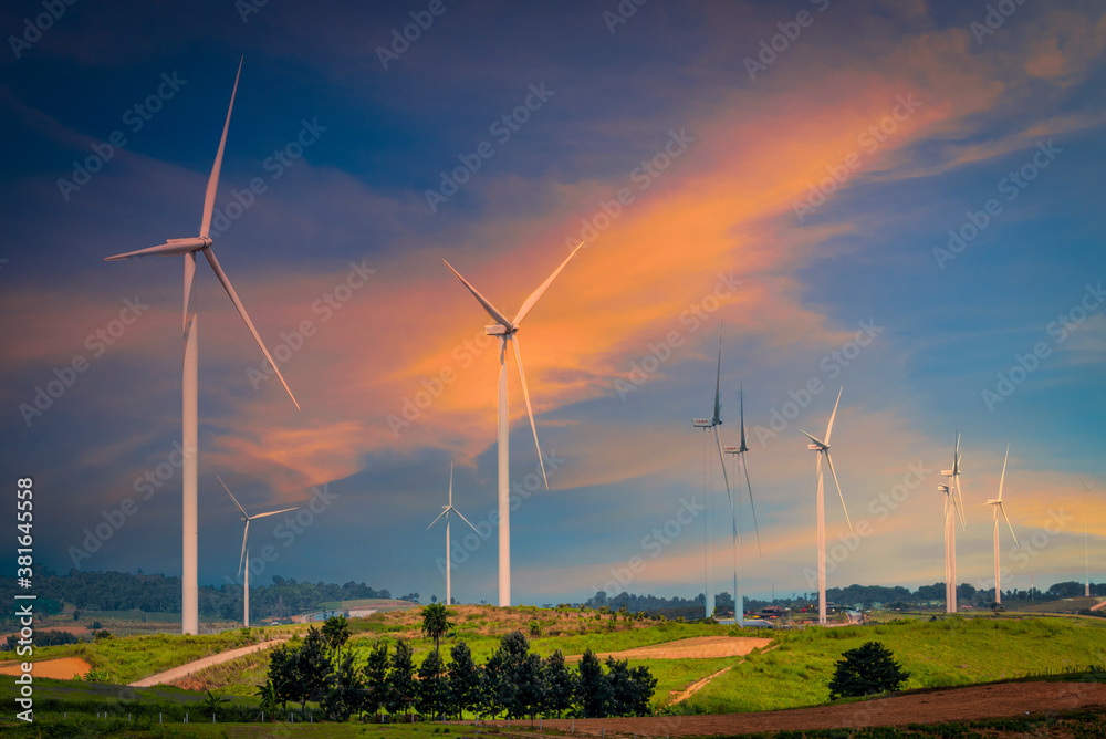 Wind turbines on mountain at sunset in Thailand.