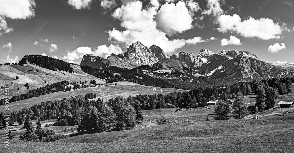 Famous Alpe di Siusi - Seiser Alm with Sassolungo - Langkofel mountain group in background at sunset