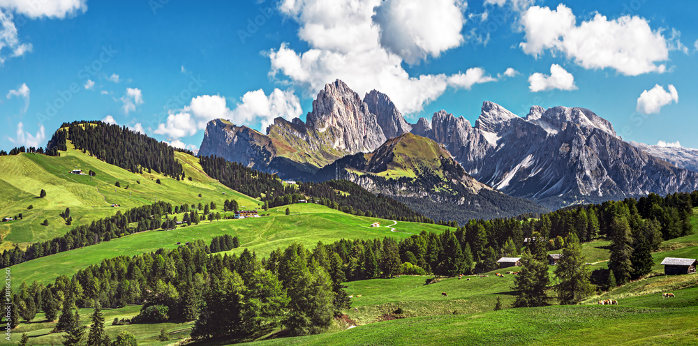 Famous Alpe di Siusi - Seiser Alm with Sassolungo - Langkofel mountain group in background at sunset