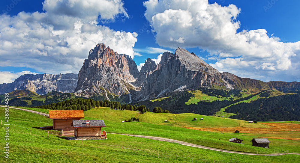 Famous Alpe di Siusi - Seiser Alm with Sassolungo - Langkofel mountain group in background at sunset