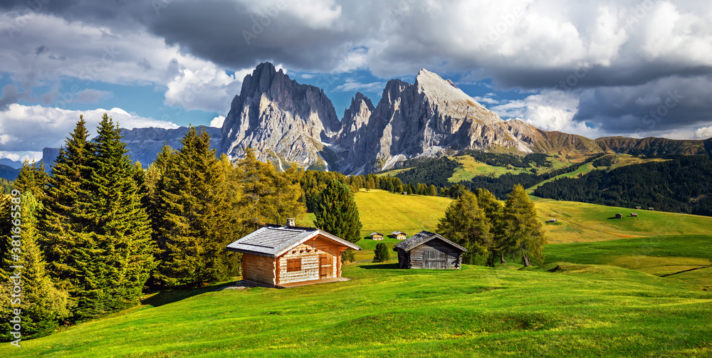 Famous Alpe di Siusi - Seiser Alm with Sassolungo - Langkofel mountain group in background at sunset