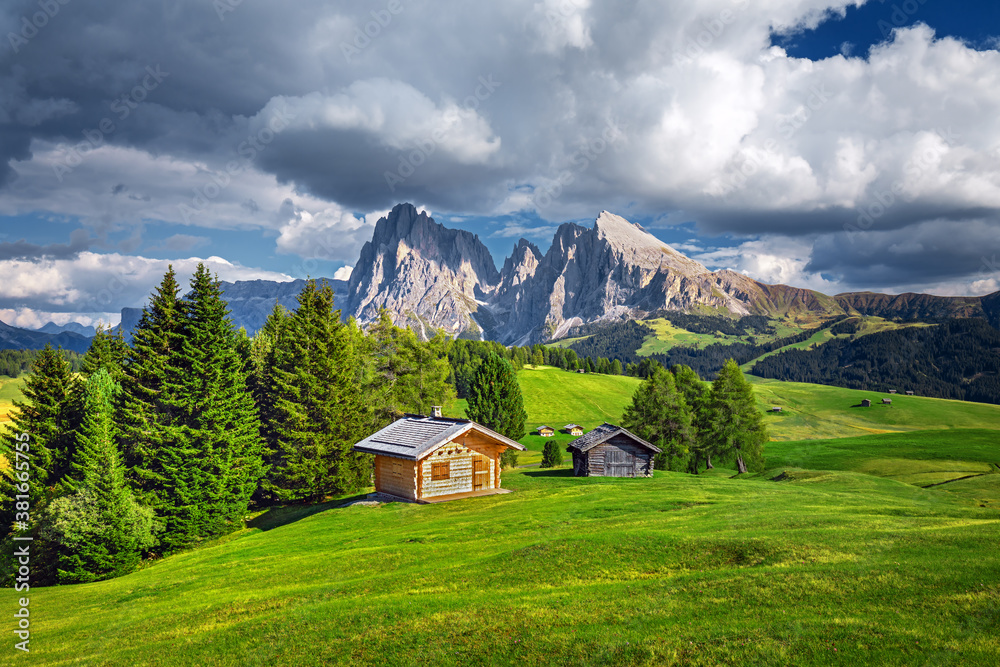 Famous Alpe di Siusi - Seiser Alm with Sassolungo - Langkofel mountain group in background at sunset