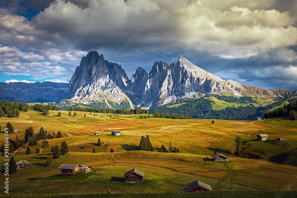 Famous Alpe di Siusi - Seiser Alm with Sassolungo - Langkofel mountain group in background at sunset