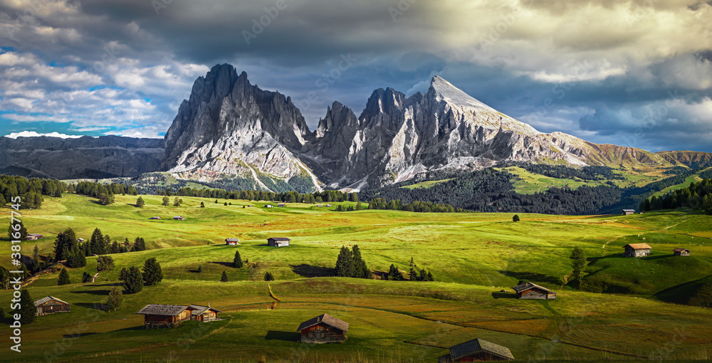 Famous Alpe di Siusi - Seiser Alm with Sassolungo - Langkofel mountain group in background at sunset