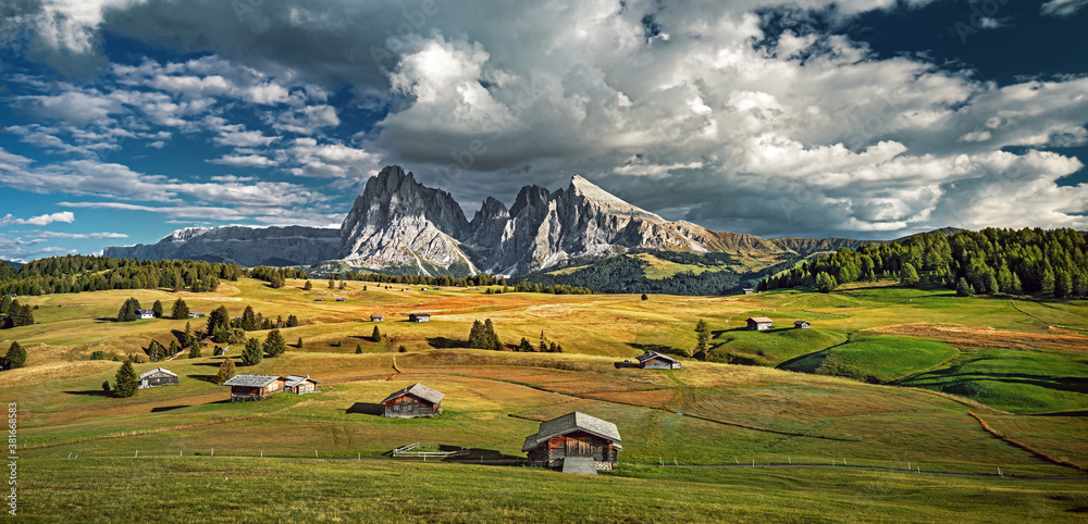 Famous Alpe di Siusi - Seiser Alm with Sassolungo - Langkofel mountain group in background at sunset