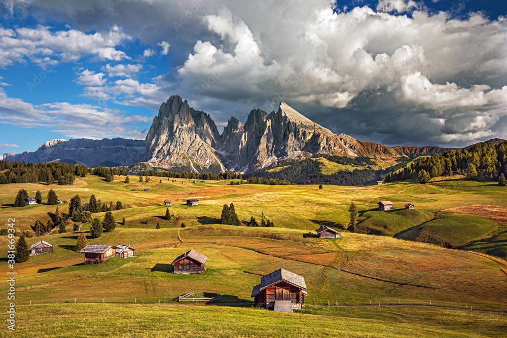 Famous Alpe di Siusi - Seiser Alm with Sassolungo - Langkofel mountain group in background at sunset