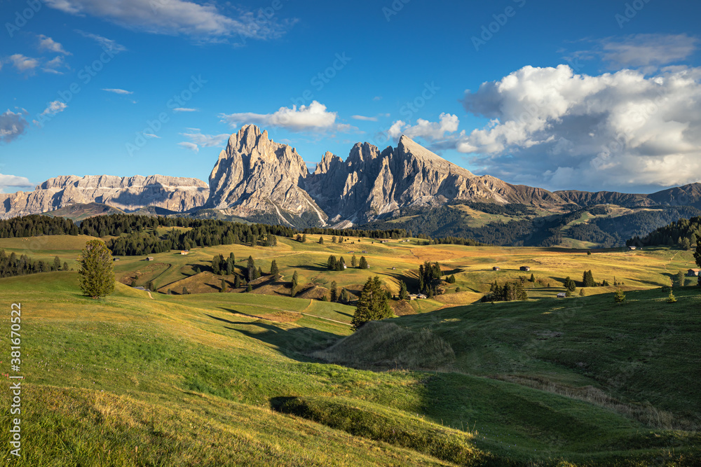 Famous Alpe di Siusi - Seiser Alm with Sassolungo - Langkofel mountain group in background at sunset