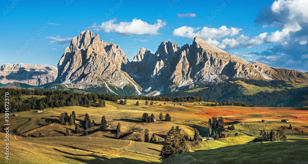 Famous Alpe di Siusi - Seiser Alm with Sassolungo - Langkofel mountain group in background at sunset