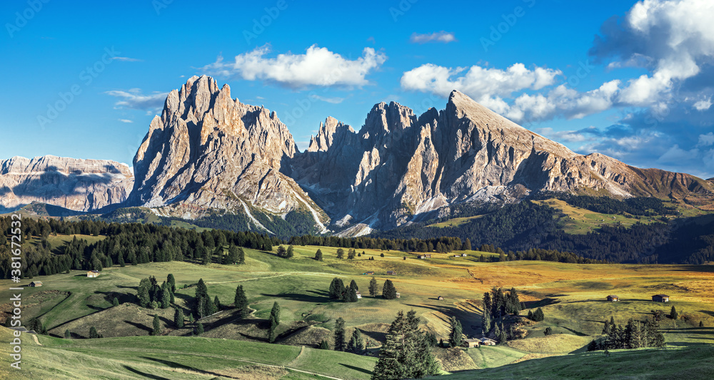 Famous Alpe di Siusi - Seiser Alm with Sassolungo - Langkofel mountain group in background at sunset