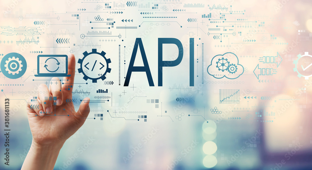 API - application programming interface concept with hand pressing a button on a technology screen