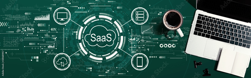 SaaS - software as a service concept with a laptop computer on a desk