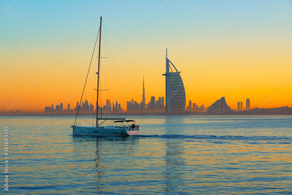 Dubai city - amazing city center skyline and famous Jumeirah beach at sunset, United Arab Emirates
