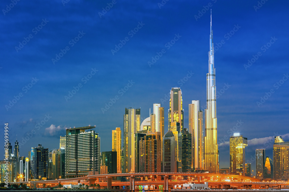 Dubai skyline with reflection in the river at sunrise , Dubai, United Arab Emirates 