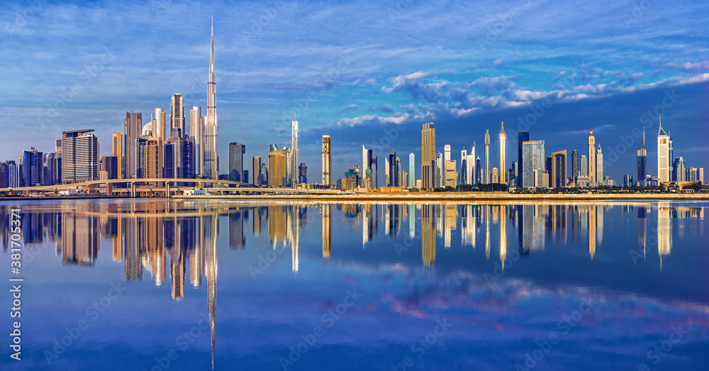 View on Dubai skyline with reflection at the sunrise, Dubai, United Arab Emirates 