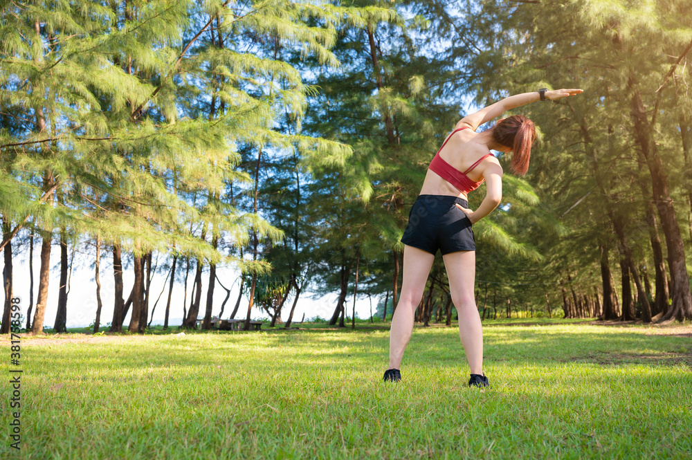 Asian sporty woman work out and stretching in morning