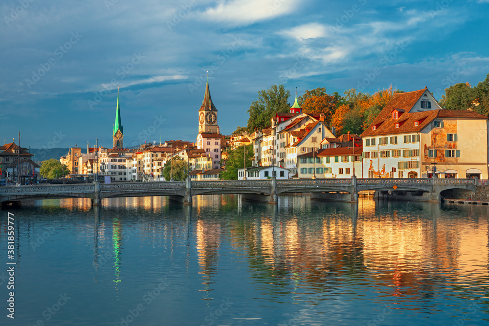 Amazing sunrise view on historic Zurich city center with famous Fraumunster and Grossmunster churche