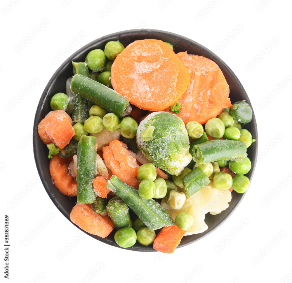 Mix of frozen vegetables in bowl on white background