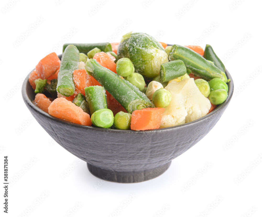 Mix of frozen vegetables in bowl on white background