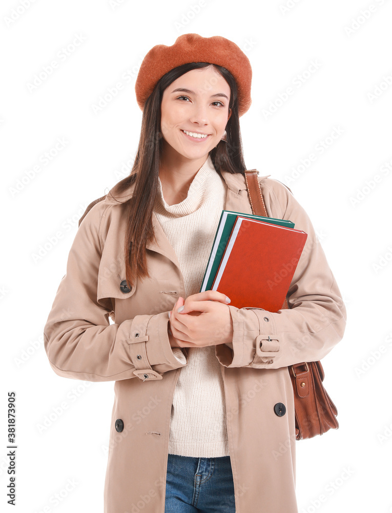 Beautiful young woman with books on white background