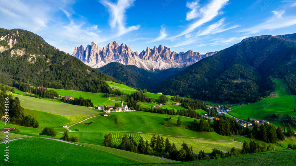 Village in the Dolomites mountain peaks in the Val di Funes, La Villa alpine village in Dolomites Mo