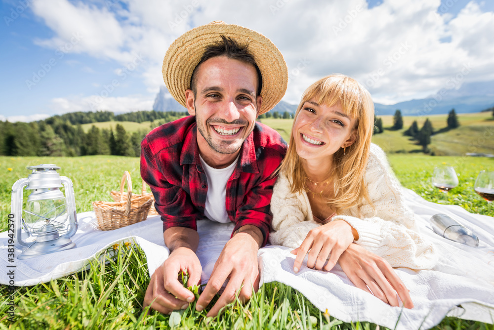 Romantic couple in love smiling reading travel diary. Boyfriend and girlfriend having fun visiting m