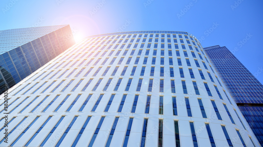 Bottom view of glass silhouette of skyscraper. Business building. Skyscraper with glass facade. Mode