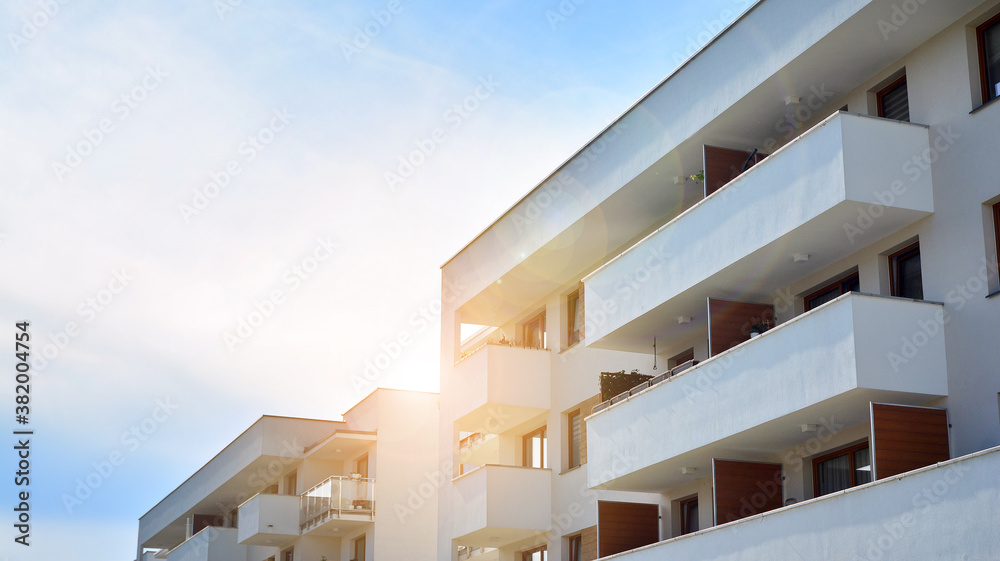 Apartment residential house and home facade architecture and outdoor facilities. Blue sky on the bac