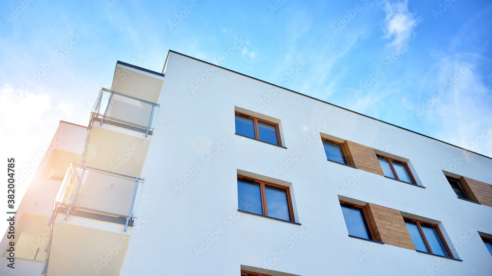 Apartment residential house and home facade architecture and outdoor facilities. Blue sky on the bac