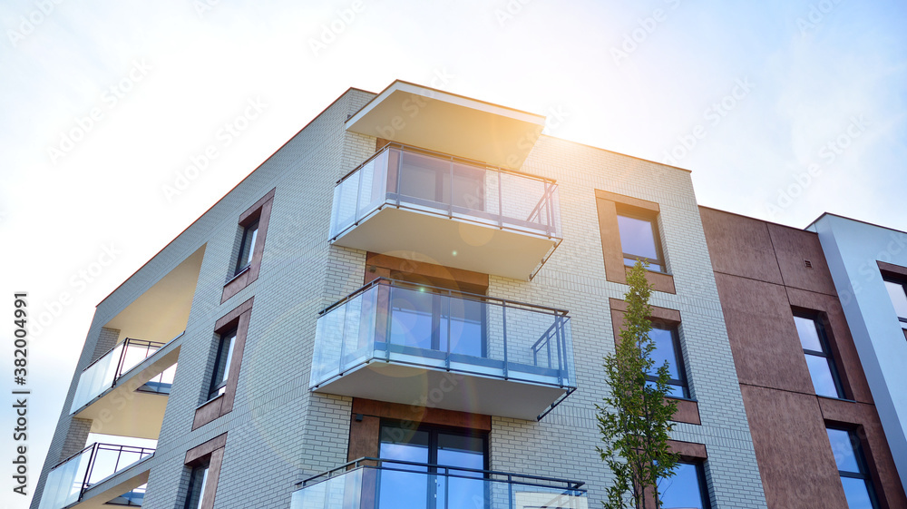 Apartment residential house and home facade architecture and outdoor facilities. Blue sky on the bac