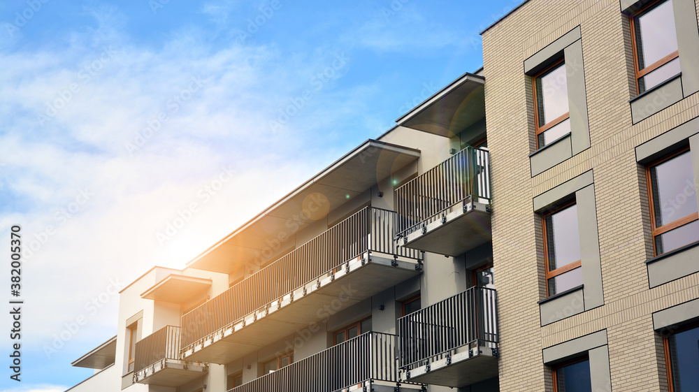 Apartment residential house and home facade architecture and outdoor facilities. Blue sky on the bac