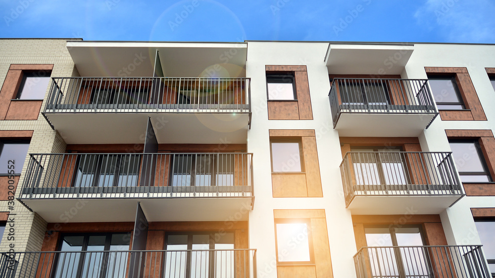 Apartment residential house and home facade architecture and outdoor facilities. Blue sky on the bac