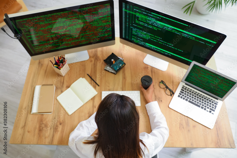 Female programmer working in office