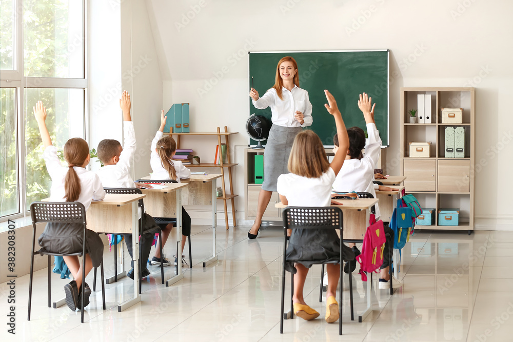 Teacher conducting lesson in classroom