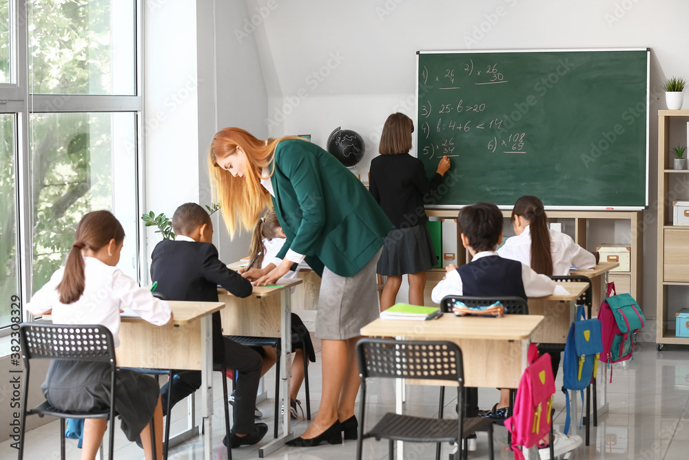 Teacher conducting lesson in classroom