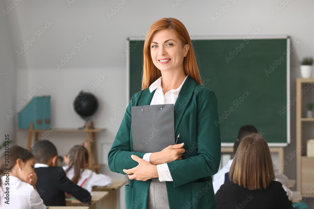 Portrait of beautiful teacher in classroom