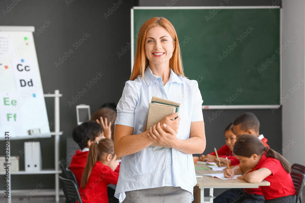 Portrait of beautiful teacher in classroom