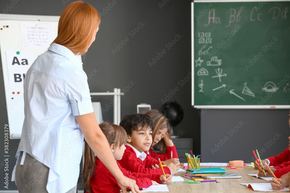 Teacher conducting lesson in classroom