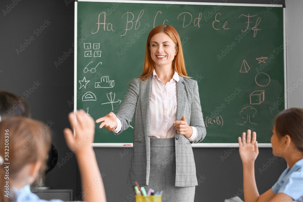 Teacher conducting lesson in classroom