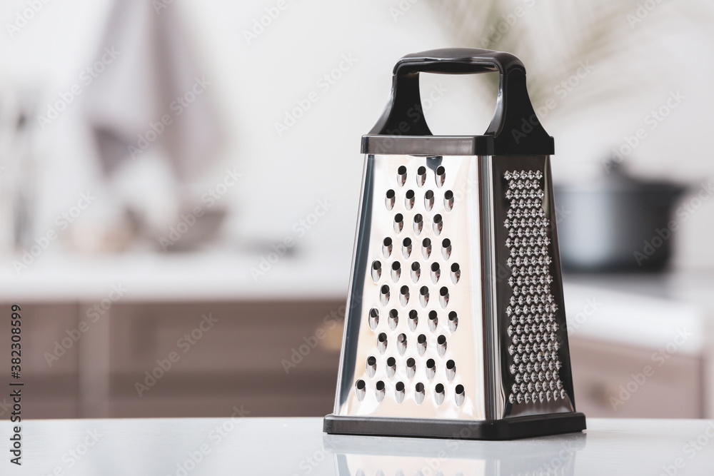 Metal grater on kitchen table